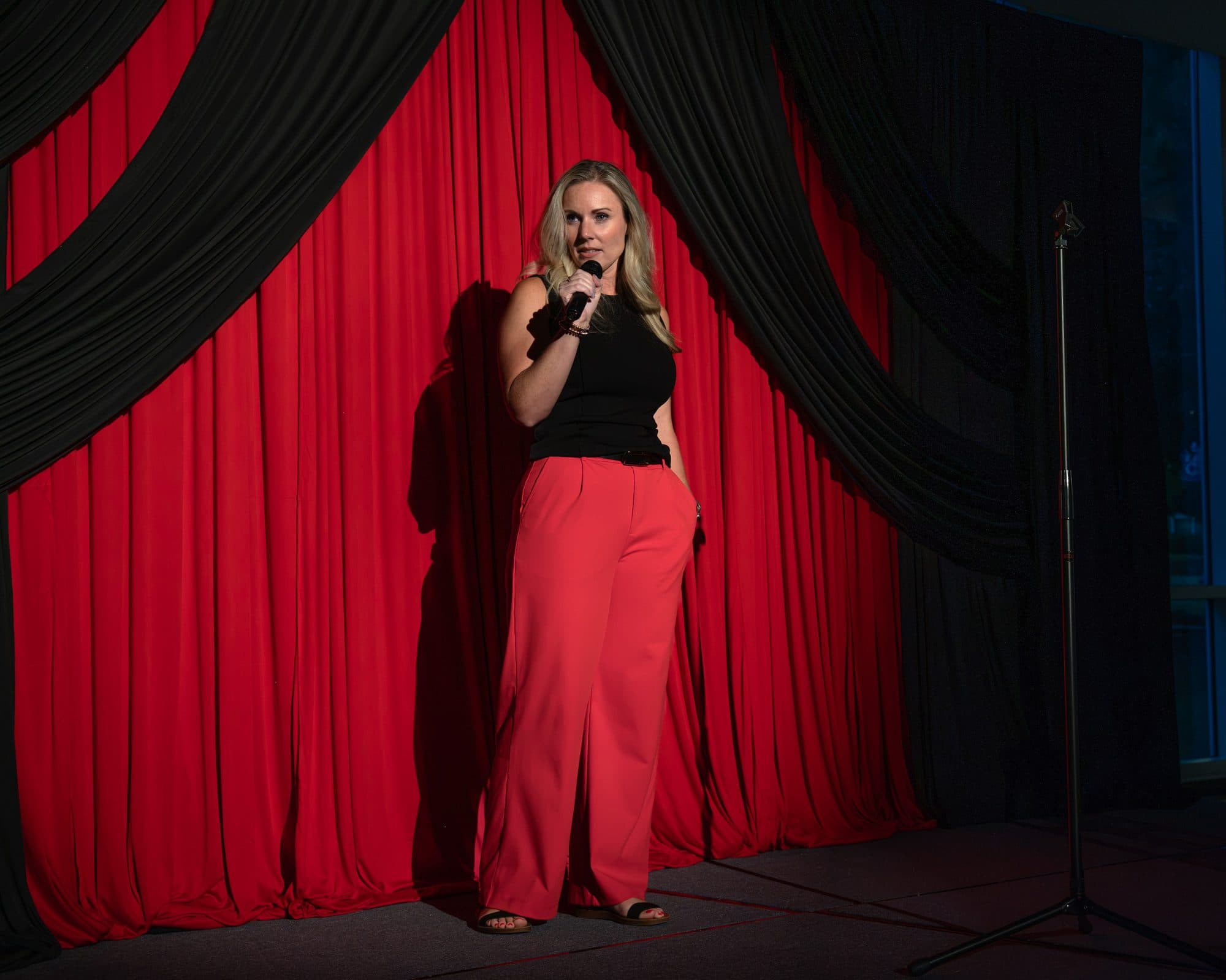 Comedian performing a stand-up set on stage at Mic Drop Masters 2026.