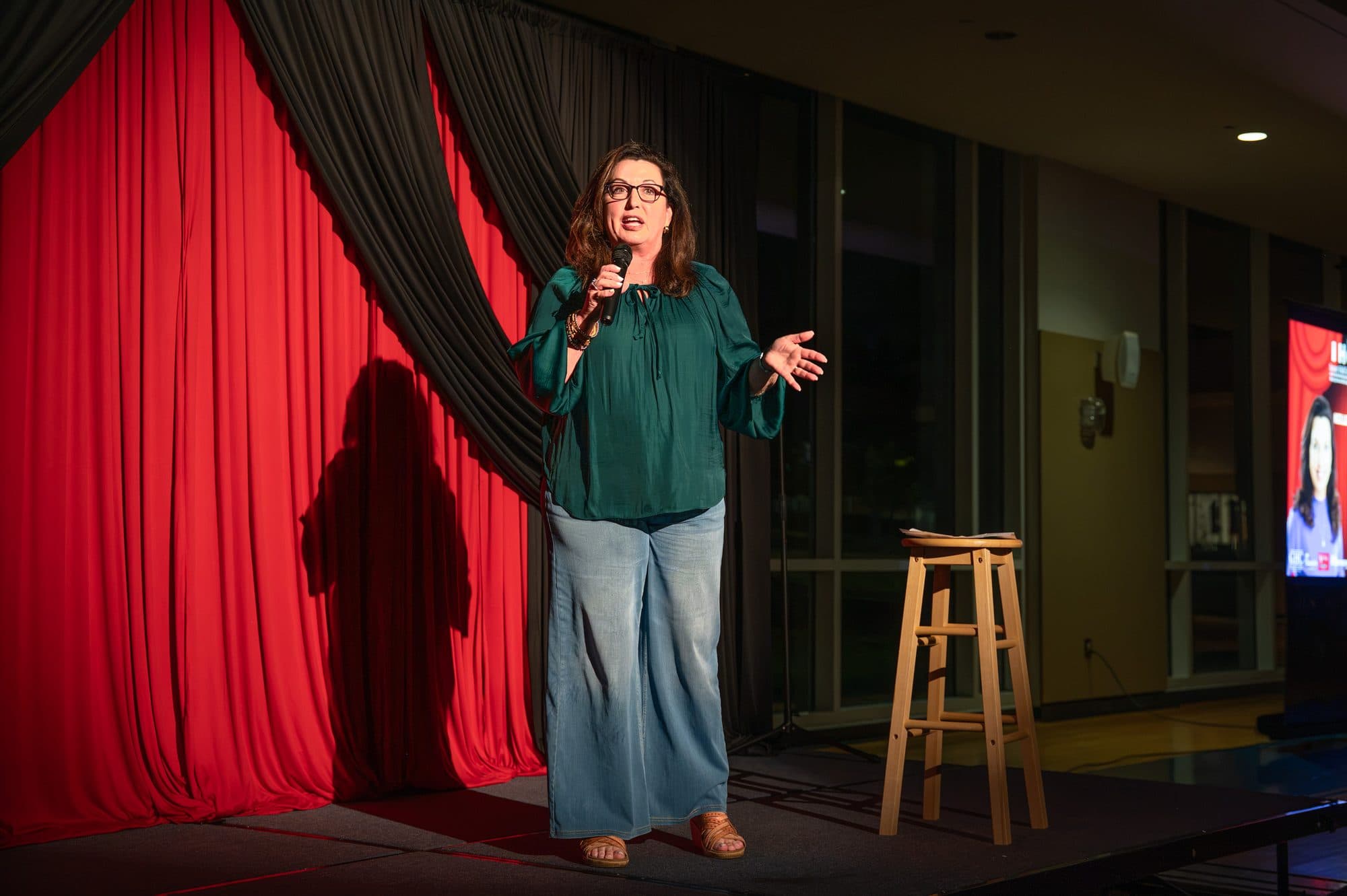 Comedian performing a stand-up set on stage at Mic Drop Masters 2026.