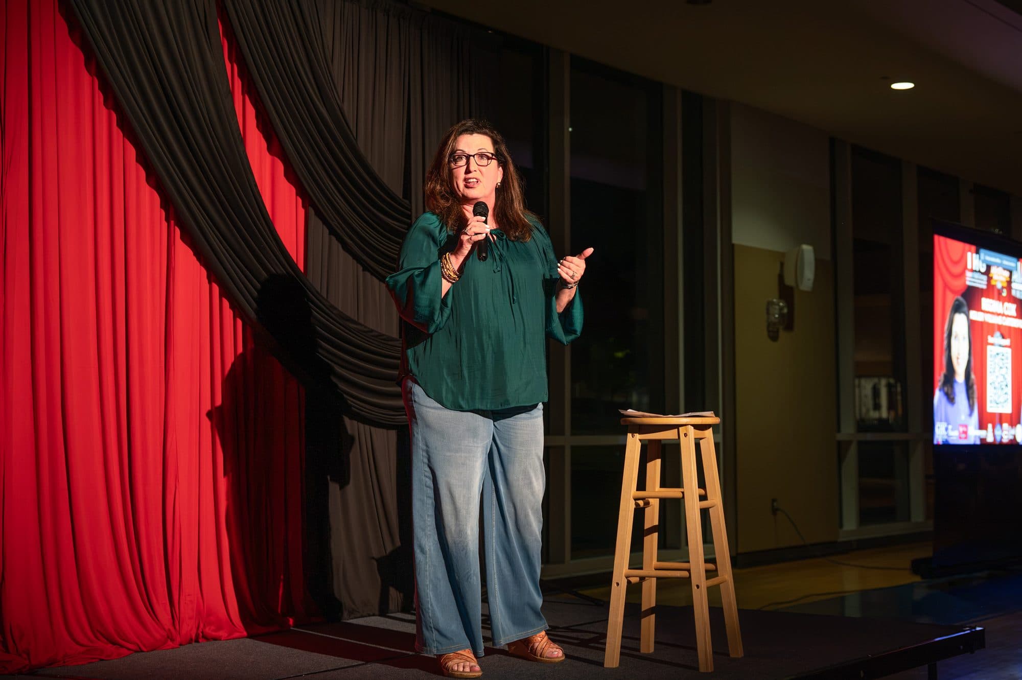 Comedian performing a stand-up set on stage at Mic Drop Masters 2026.